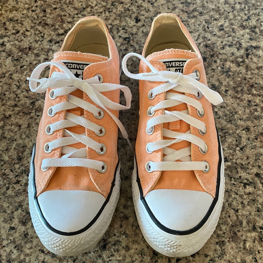 Unisex Chuck Taylors, Women’s 7, Men’s 5, minimal wear, light orange/peach color